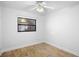 Bright bedroom with wood-look tile floors and ceiling fan at 1621 Puritan,, Winter Park, FL 32792