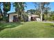 House exterior with lush landscaping and driveway at 1621 Puritan,, Winter Park, FL 32792