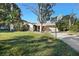 Home exterior featuring a large yard and basketball court at 1621 Puritan,, Winter Park, FL 32792