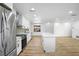 Open concept kitchen with stainless steel appliances and white cabinets at 1621 Puritan,, Winter Park, FL 32792