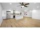 Modern kitchen features white cabinets, stainless steel appliances, and a large island at 1621 Puritan,, Winter Park, FL 32792