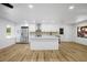 Modern kitchen with white cabinets, island, and new appliances at 1621 Puritan,, Winter Park, FL 32792