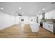 Open concept kitchen features white cabinets and island at 1621 Puritan,, Winter Park, FL 32792