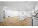Modern kitchen with white cabinets, island, and hardwood floors at 1621 Puritan,, Winter Park, FL 32792
