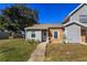 Inviting exterior with a brick and gray siding, a walkway, and well-manicured lawn at 201 Arbor Cir, Sanford, FL 32773