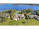 Lakefront home with lush landscaping at 2032 Dumas Dr, Deltona, FL 32738