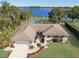 Single-story home with lakefront access, private pool, and mature landscaping at 2032 Dumas Dr, Deltona, FL 32738