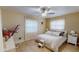Cozy bedroom with a ceiling fan and plenty of natural light at 2032 Dumas Dr, Deltona, FL 32738