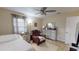 Relaxing bedroom with a comfortable bed and recliner at 2032 Dumas Dr, Deltona, FL 32738