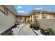 Inviting front entry with landscaped walkway, and well maintained gardens at 2032 Dumas Dr, Deltona, FL 32738