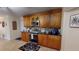 Well-equipped kitchen featuring wood cabinets and a stove at 2032 Dumas Dr, Deltona, FL 32738