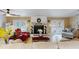 Comfortable living room with fireplace, large windows, and lake views at 2032 Dumas Dr, Deltona, FL 32738