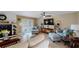 Relaxing living room with a TV, comfortable seating, and a cozy atmosphere at 2032 Dumas Dr, Deltona, FL 32738
