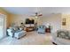 Bright living room with comfy seating and a large TV at 2032 Dumas Dr, Deltona, FL 32738