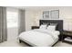 Bedroom with dark gray headboard and soft bedding at 2689 Sweet Acacia Dr, Clermont, FL 34711