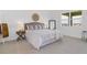 Spacious bedroom with neutral decor and carpeted floors at 2697 Sweet Acacia Dr, Clermont, FL 34711