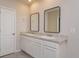 Double vanity bathroom with modern mirrors and flooring at 30303 Armenia Rd, Leesburg, FL 34748