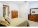 Bedroom with wooden dresser and a double bed at 3905 Angola Ln, Sanford, FL 32771