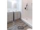 Stylish bathroom with double vanities and a walk-in shower at 4 Cedar Trace Way, Ocala, FL 34472
