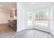Bright dining area with large windows and vinyl flooring at 4 Cedar Trace Way, Ocala, FL 34472