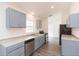 Modern kitchen with stainless steel appliances and grey cabinets at 4 Cedar Trace Way, Ocala, FL 34472