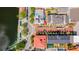 Aerial view of a waterfront town center with shops and restaurants along the water's edge at 418 Water St, Kissimmee, FL 34747