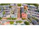 Aerial view of a vibrant town center with shops, restaurants, and ample parking at 418 Water St, Kissimmee, FL 34747