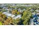 Aerial perspective of townhomes and surrounding trees at 418 Water St, Kissimmee, FL 34747