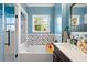Bathroom with double vanity, patterned tile, and a soaking tub at 418 Water St, Kissimmee, FL 34747