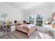 Charming bedroom with a pink and leopard print bedding set and a built-in desk at 418 Water St, Kissimmee, FL 34747