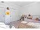 Bedroom with built-in shelving, a pink bedding set, and a large closet at 418 Water St, Kissimmee, FL 34747