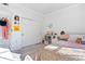 Bedroom with built-in shelving, a pink bedding set, and a large closet at 418 Water St, Kissimmee, FL 34747