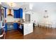 Modern kitchen with blue cabinets, copper accents, and a marble island at 418 Water St, Kissimmee, FL 34747