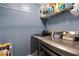 Laundry room with modern washer and dryer, and ample storage space at 418 Water St, Kissimmee, FL 34747