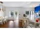 Sunlit living room with hardwood floors and access to a balcony at 418 Water St, Kissimmee, FL 34747