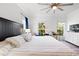 Spacious main bedroom with king-size bed, ceiling fan and large windows at 418 Water St, Kissimmee, FL 34747