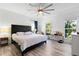 Spacious main bedroom with king-size bed, ceiling fan and large windows at 418 Water St, Kissimmee, FL 34747