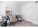 Home office with hardwood floors, built-in shelving and large windows at 418 Water St, Kissimmee, FL 34747