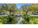 Charming bridge over calm waterway, lush landscaping at 418 Water St, Kissimmee, FL 34747