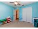 Bedroom with double door closet and carpet flooring at 5019 Log Wagon Rd, Ocoee, FL 34761