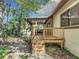 Wooden deck with steps leading to a screened porch at 639 Marni Dr, Winter Springs, FL 32708