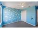 bedroom with blue walls, cloud and parachute decor at 755 Kildrummy Dr, Davenport, FL 33896