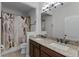 Bathroom with double sinks and granite countertops at 8279 Nemours Pkwy, Orlando, FL 32827