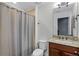 Clean bathroom with shower/tub combo, granite vanity, and updated fixtures at 8279 Nemours Pkwy, Orlando, FL 32827