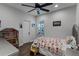 Bright bedroom with a twin bed, hardwood floors, and plenty of natural light at 8279 Nemours Pkwy, Orlando, FL 32827