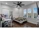 Bedroom with built-in desk and hardwood floors at 8279 Nemours Pkwy, Orlando, FL 32827