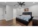 Spacious bedroom with hardwood floors and a ceiling fan at 8279 Nemours Pkwy, Orlando, FL 32827