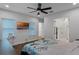 Main bedroom with large windows and a ceiling fan at 8279 Nemours Pkwy, Orlando, FL 32827