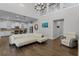 Bright living room with vaulted ceilings, hardwood floors, and large sectional sofa at 8279 Nemours Pkwy, Orlando, FL 32827