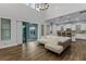 Open living space with hardwood floors and sliding glass doors to patio at 8279 Nemours Pkwy, Orlando, FL 32827